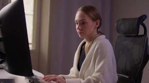 Female coder working. Female developer studying terminal output late at night Stock Footage 347879677