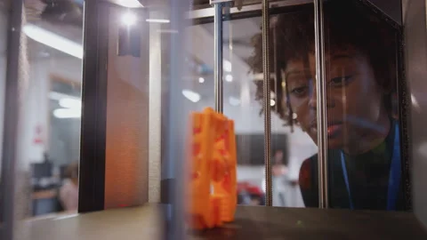 Female College Student Studying Engineering Using 3D Printing Machine Stock Footage 130638292