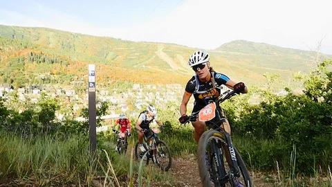Female competitor in the Point to Point Mountain Bike Race, Utah. Stock Footage 106791226