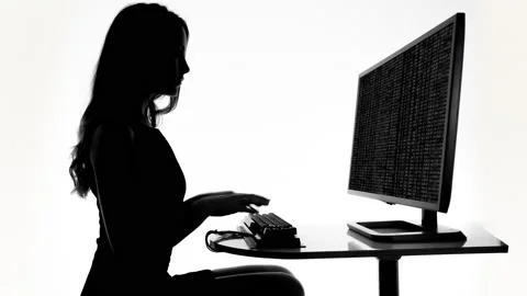 Female on a computer with code Stock Footage 237683510