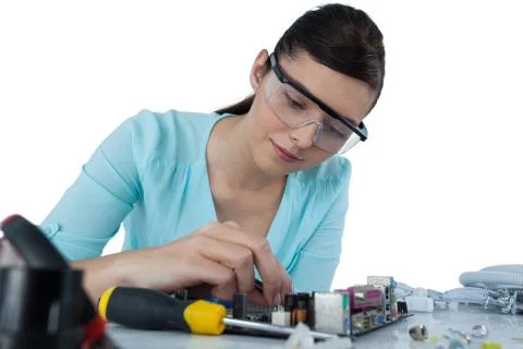 Female computer engineer repairing computer motherboard Stock Photos