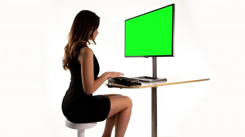 Female on a computer with green screen | Stock Video | Pond5