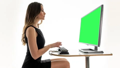 Female on a computer with green screen | Stock Video | Pond5