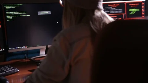 Female computer programmer coding, hacking in dark room Stock Footage 69793851