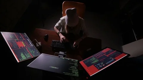Female computer programmer coding, hacking in dark room Stock Footage 69794638