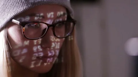 Female computer programmer coding, hacking in dark room Stock Footage 70095733