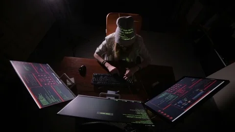 Female computer programmer coding, hacking in dark room Stock Footage 70096099