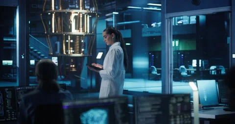 Female Computer Scientist Working with Quantum Computer Stock Footage 318965279