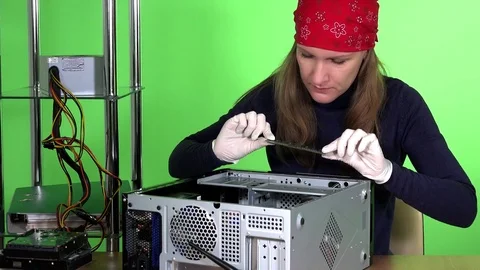 Female computer specialist removing ram memory from desktop computer Stock Footage 74121970