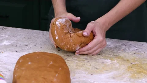 A female confectioner forms dough blanks for future baking of desserts Stock Footage 219570463