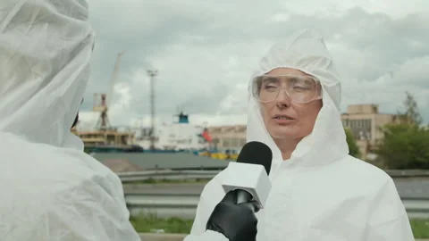 Female Construction Site Worker in Protective Suit Giving Interview for TV 库存影片 283539619