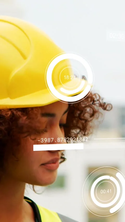 Female construction worker reading timers as animated HUD bars updating helmet Stock Footage 334390992
