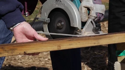 Female Construction Worker Using Circular Saw Stock Footage 81751200