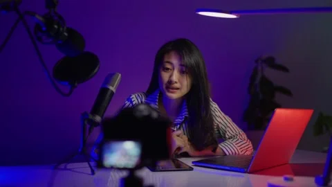 Female content creator is being streamed live in her home. Stock Footage 149649653