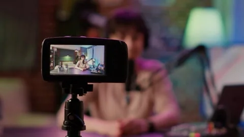 Female Content Creator Streaming Live and Filming Vlog at Home Studio Stock Footage 328576065