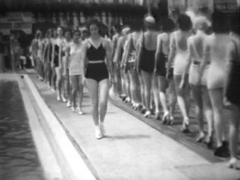 Female contestants in a beauty contest model swimsuits and have their Stock Footage