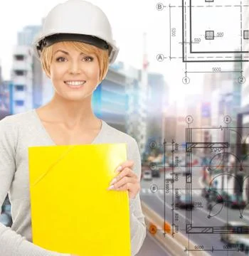 Female contractor in helmet with folder Foto stock