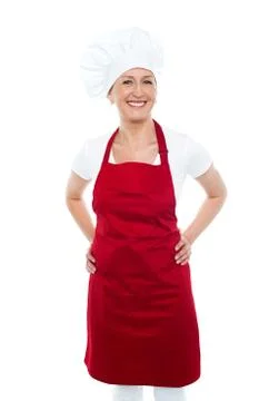 Female cook posing with hands on her waist Fotos Stock