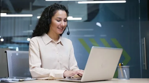 Female corporate operator in headset working in customer support service on help Stock Footage 297293847
