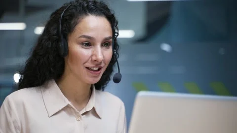 Female corporate operator in wireless headset working in customer support servic Stock Footage 296016936