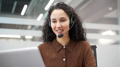 Female corporate operator in wireless headset working in customer support servic Stock Footage 317159395