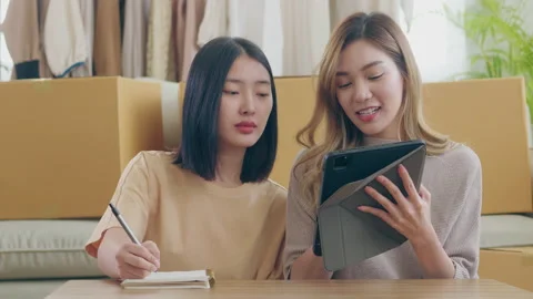 Female couple Taking orders from customers and  happy from selling products Video stock 219982005