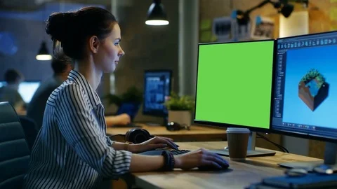 Female Creative Works on a Computer with Mock-up Green Screen. Stock Footage