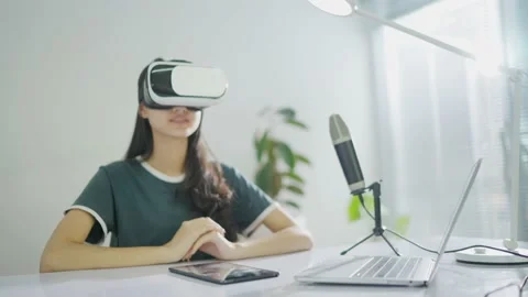 Female creator content Playing vr in the living room with hand Stock Footage 149825123