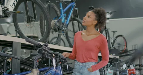 Female Customer Browsing Bicycle Store Stock Footage 250629459