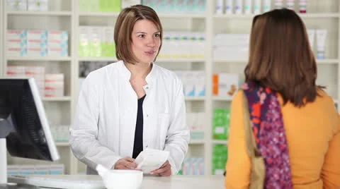 Female customer at pharmacy Stock Footage