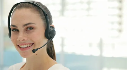 Female customer service executive using headphones in office Stock Footage 52690571