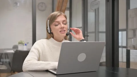 Female Customer Service Representative Doing Video Chat, Talking with Customers Stock-Footage 303880962