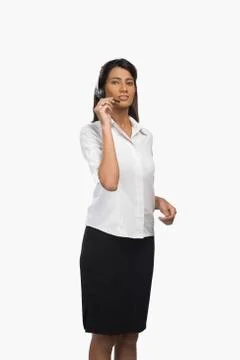 Female customer service representative using a headset 写真素材