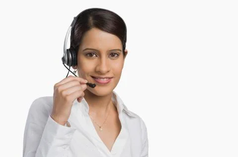Female customer service representative using a headset 写真素材
