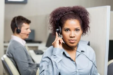 Female Customer Service Representative Using Headset 写真素材