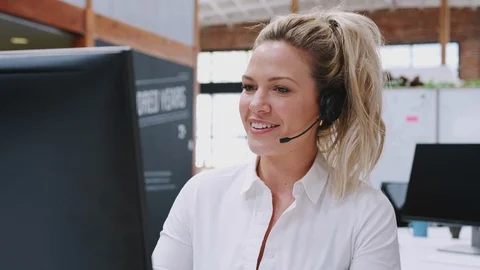 Female Customer Services Agent Working At Desk In Call Center Video stock 111924555