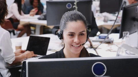 Female Customer Services Agent Working At Desk In Call Center Stock Footage 111924730