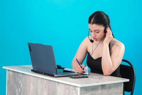 Female Customer Support Agent Working at Desk Stock Photos