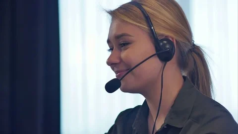 Female customer support operator with headset talking and smiling Stock-Footage 78726418