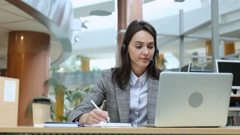 Female customer support operator with headset and smiling. Stock Footage 158448788