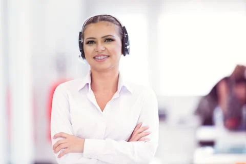 Female customer support operator with headset and smiling Stock Photos