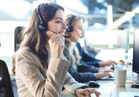 Female customer support operator with headset and smiling, Stock-Fotos