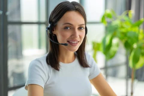 Female customer support operator with headset and smiling Foto stock
