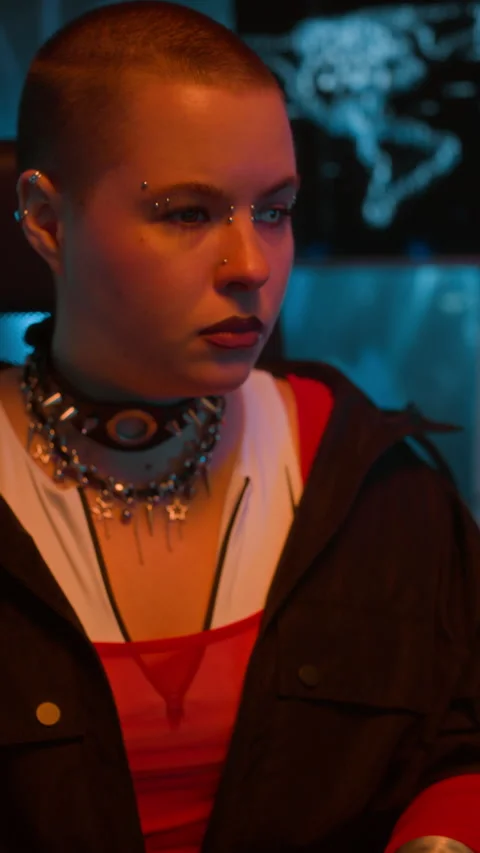 Female Cyberpunk Hacker Coding on Computer in Neon Workspace Stock Footage 327635627