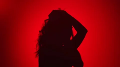 Female dancer dancing raising hands enjoying freedom. Medium close up shot on 4k Video stock 150994491