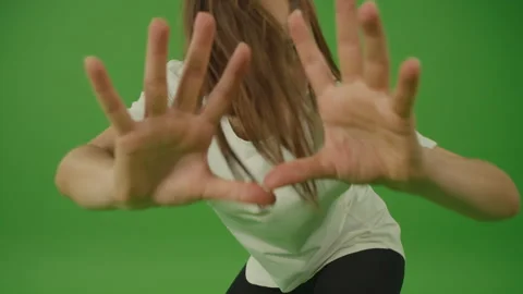 Female Dancer Performing a Dance, Moves Rhythmically Looking at the Camera. Stock Footage 224110783
