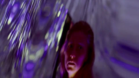 Female Dancer Performing Gracefully in front of Distorting Neon Lit Mirror Stock Footage 306983163