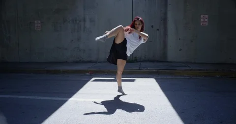 Female dancer performing her routine under an overpass 스톡 동영상 97023447