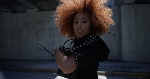 Female dancer performing her routine under an overpass Stock Footage 97023919