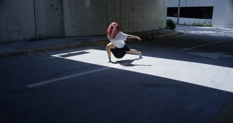 Female dancer performing her routine under an overpass Stock Footage 97032928